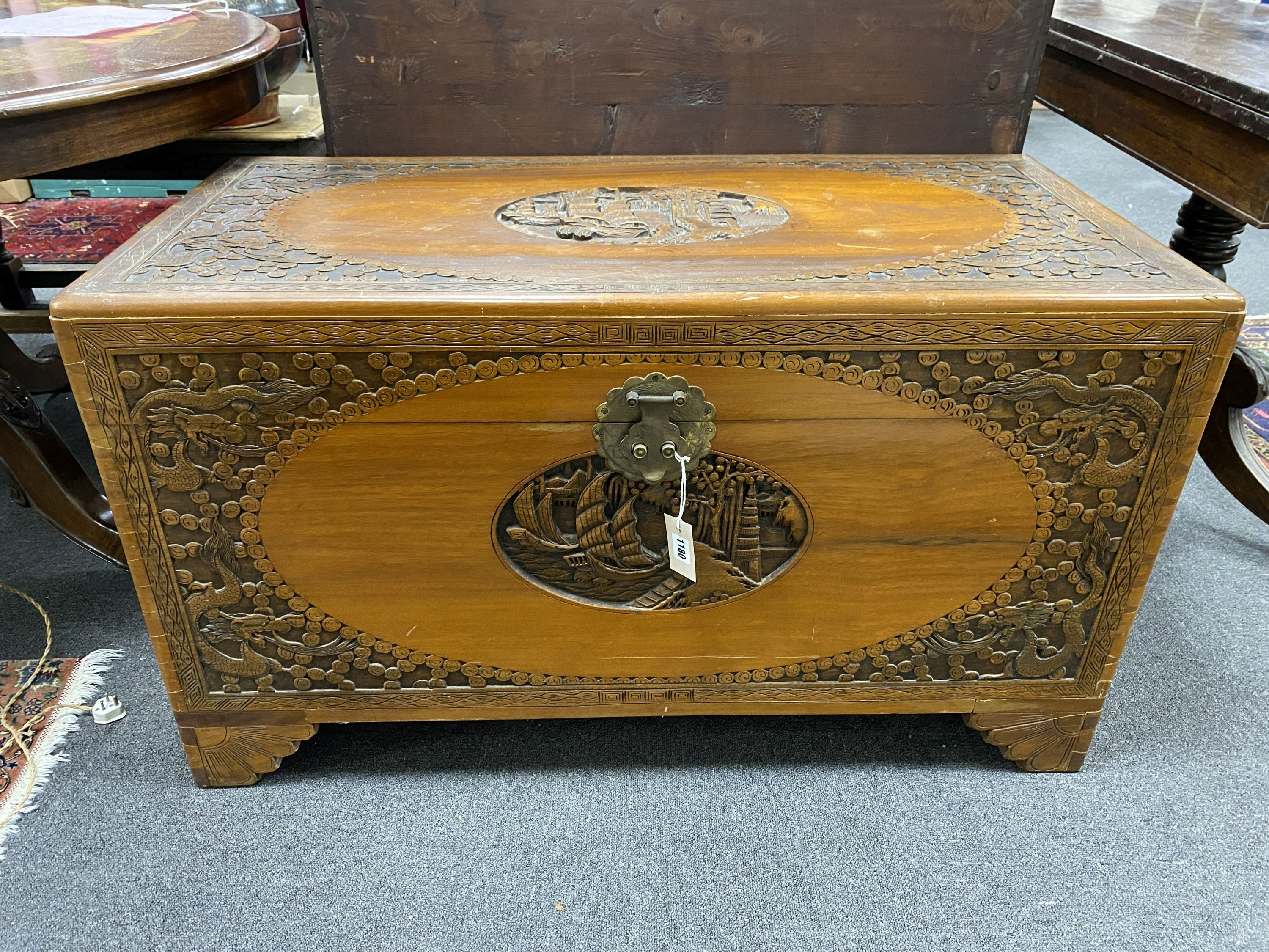 A Chinese carved camphorwood chest, length 104cm, depth 51cm, height 60cm